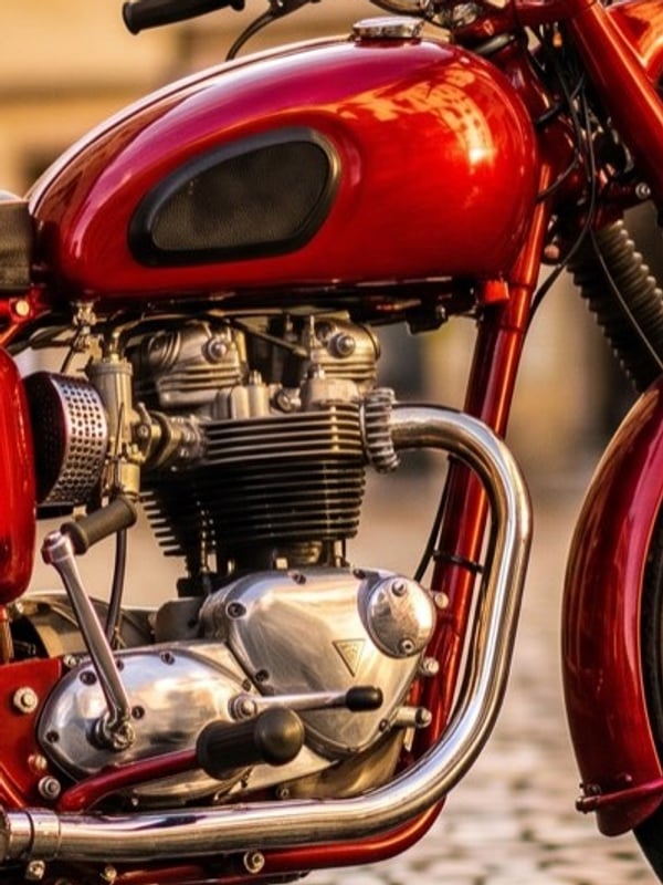 Before: soft, low-resolution crop of a red vintage motorcycle photo, enlarged with plain bicubic resizing
